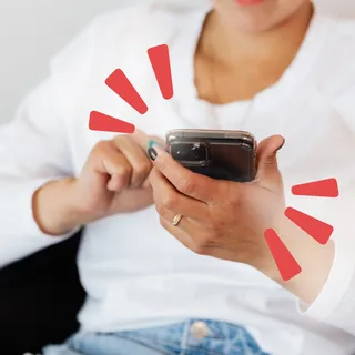 Someone holds a cell phone