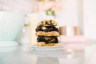 A plate of cookies on a small plate in a kitchen