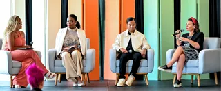 Laurel Mintz moderates a speaker panel with three guests