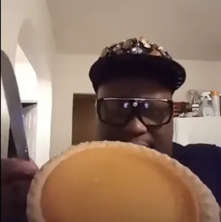 Man shows a pie to the camera